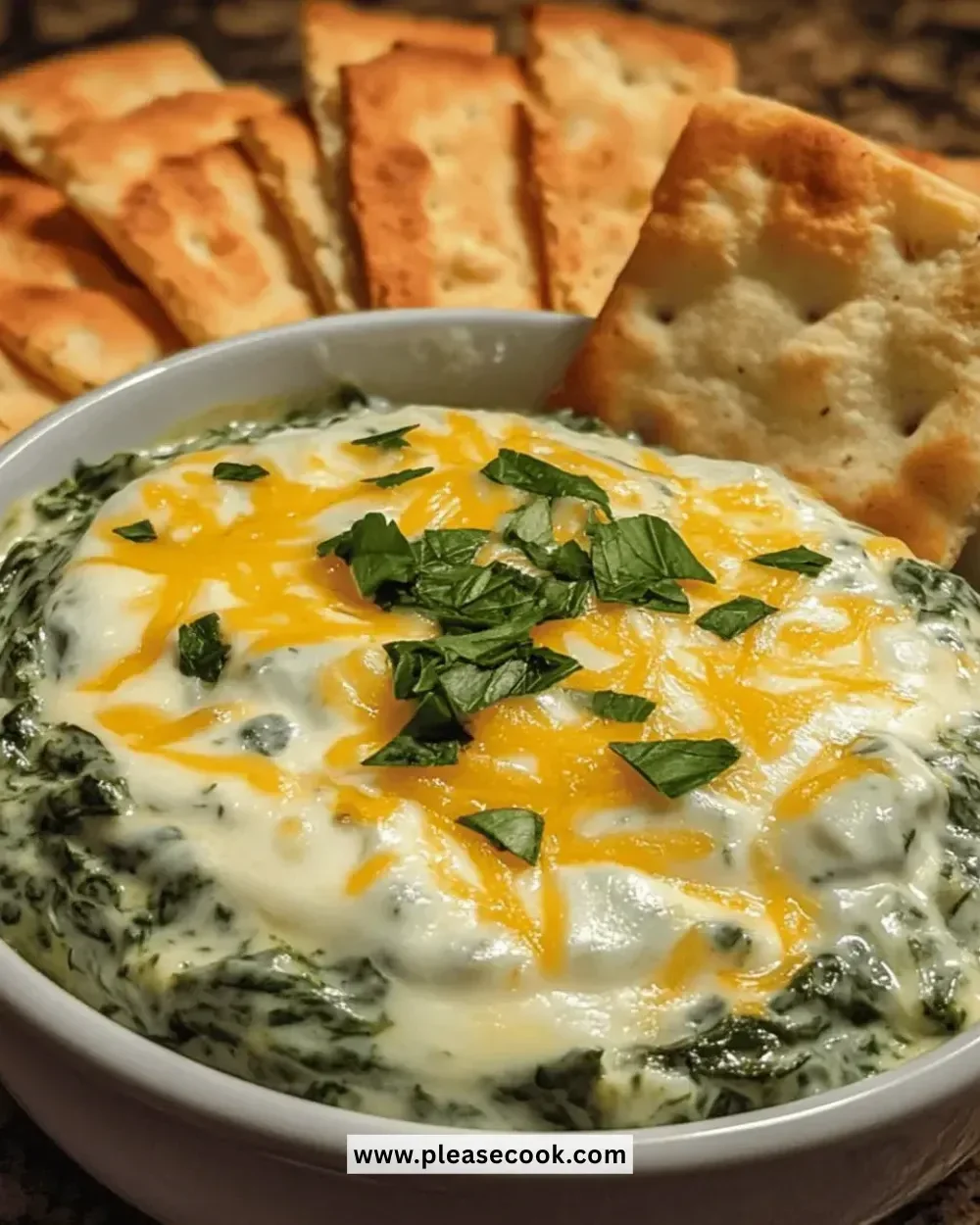 Creamy spinach cheese dip served in a bowl with fresh vegetables