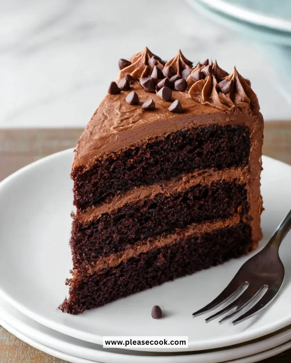 Decadent triple chocolate cake with layers of rich chocolate frosting