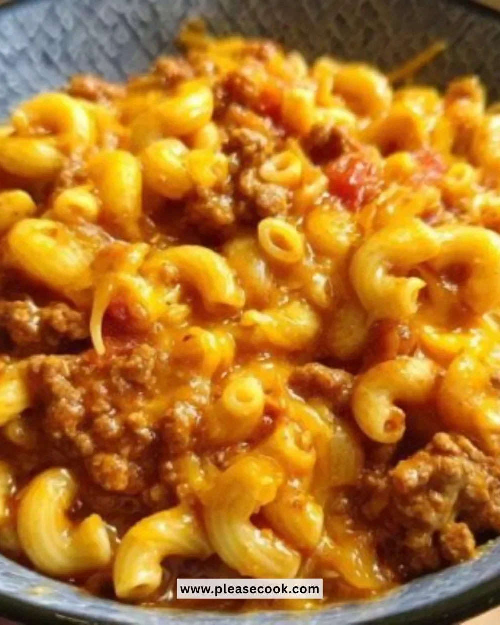 Delicious bowl of Instant Pot Chili Mac topped with cheese and herbs