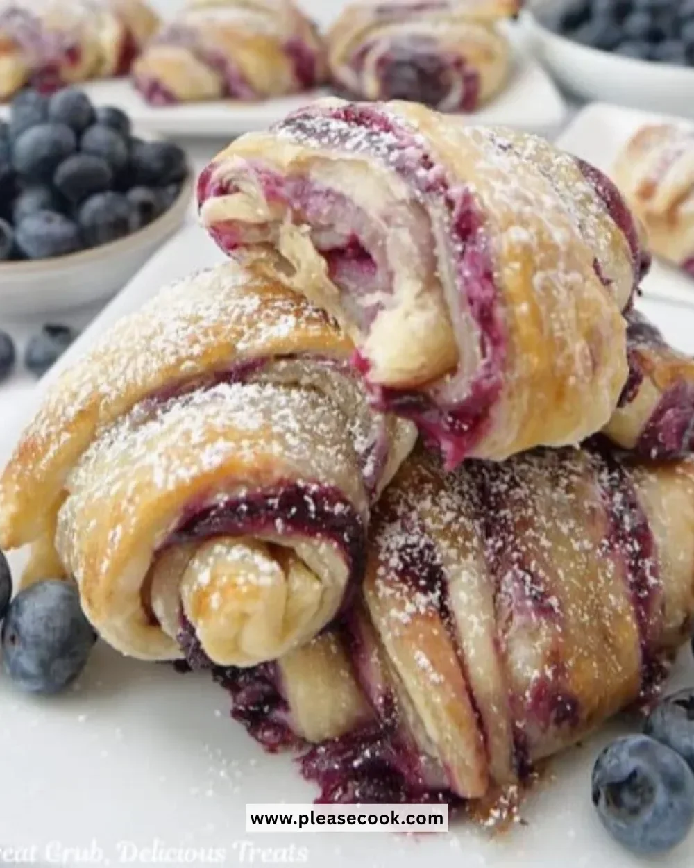 Blueberry cream cheese puff pastry on a plate with fresh berries
