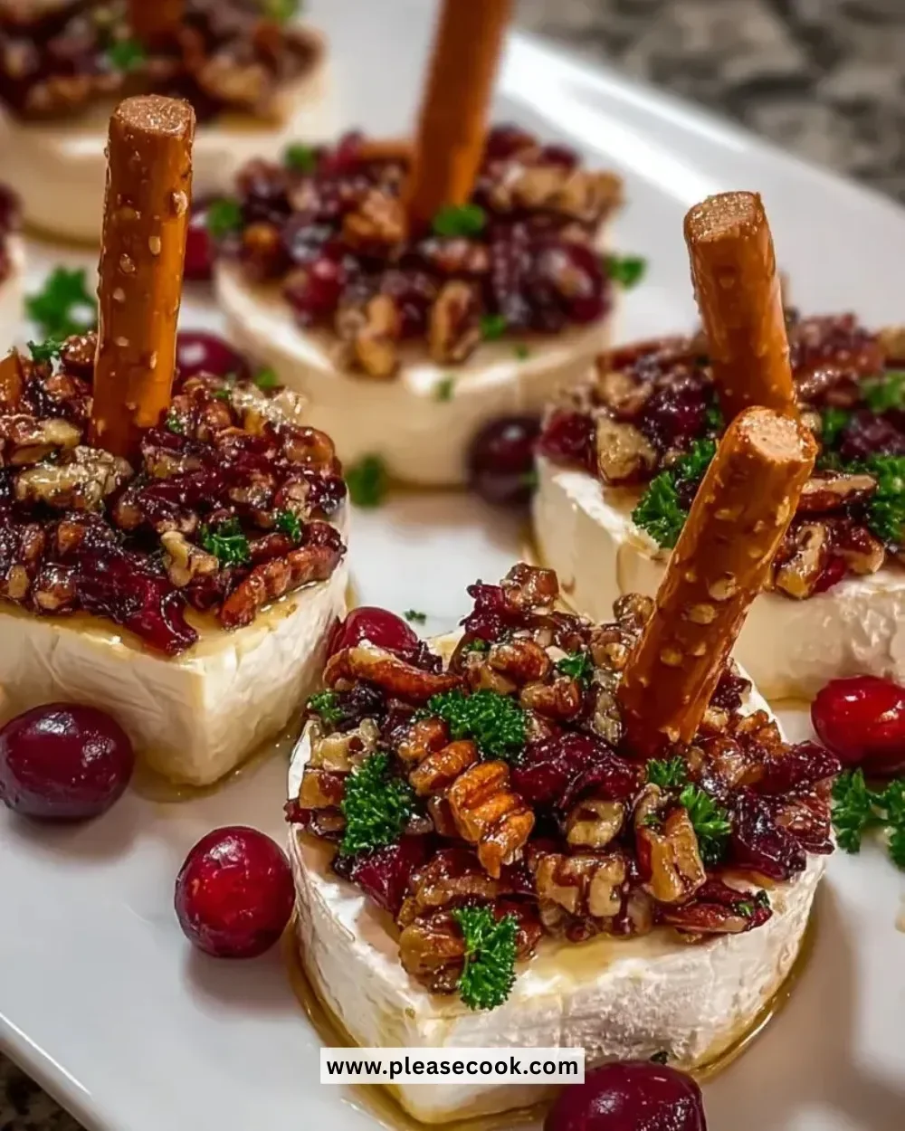 Candied Pecan Cranberry Brie Bites served on a platter
