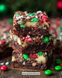 Delicious Christmas Magic Layer Brownie Bars topped with festive decorations.