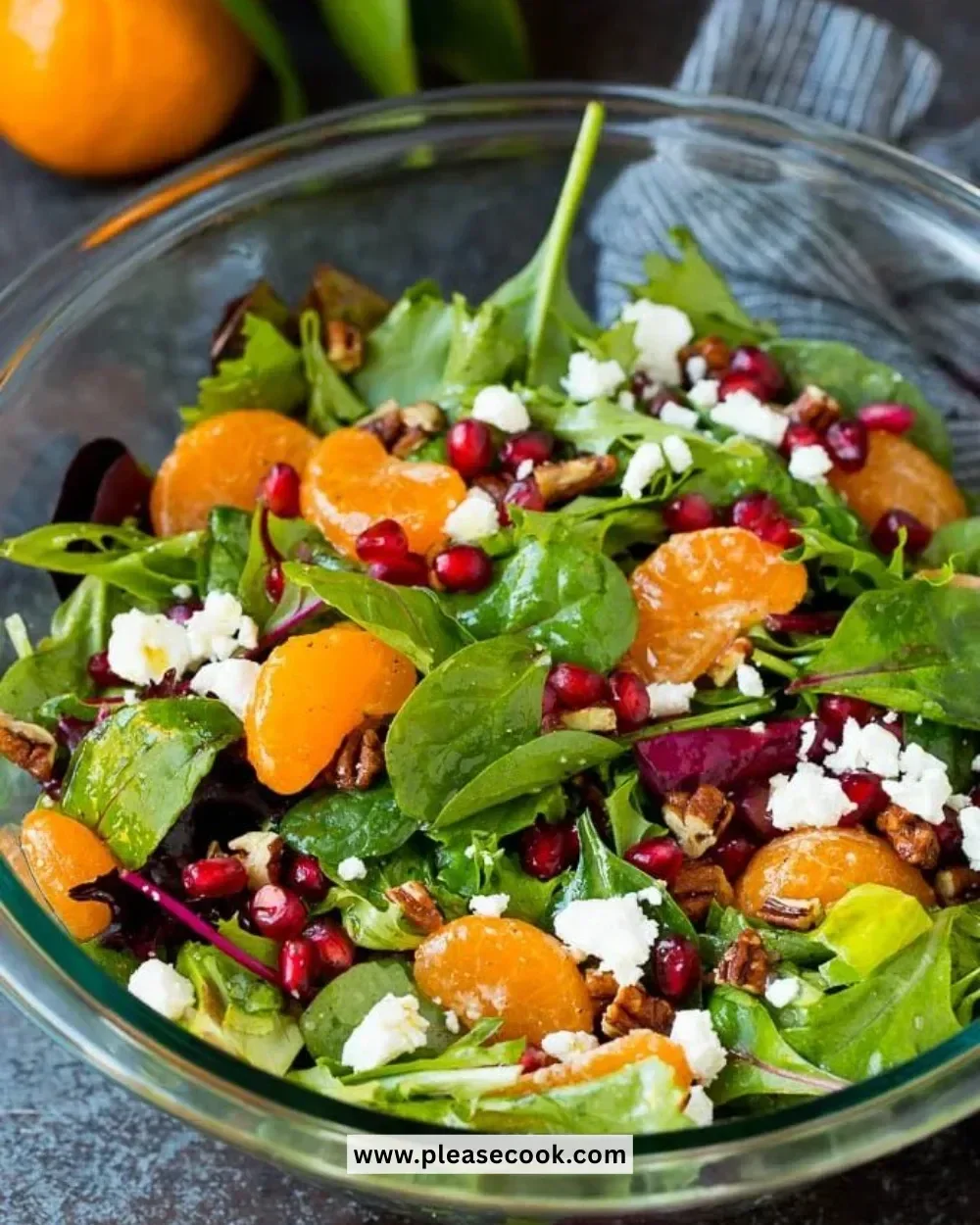 A vibrant Christmas Salad with mixed greens, pomegranate, and festive toppings.