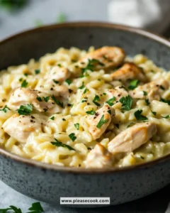 Delicious creamy orzo with chicken served in a bowl