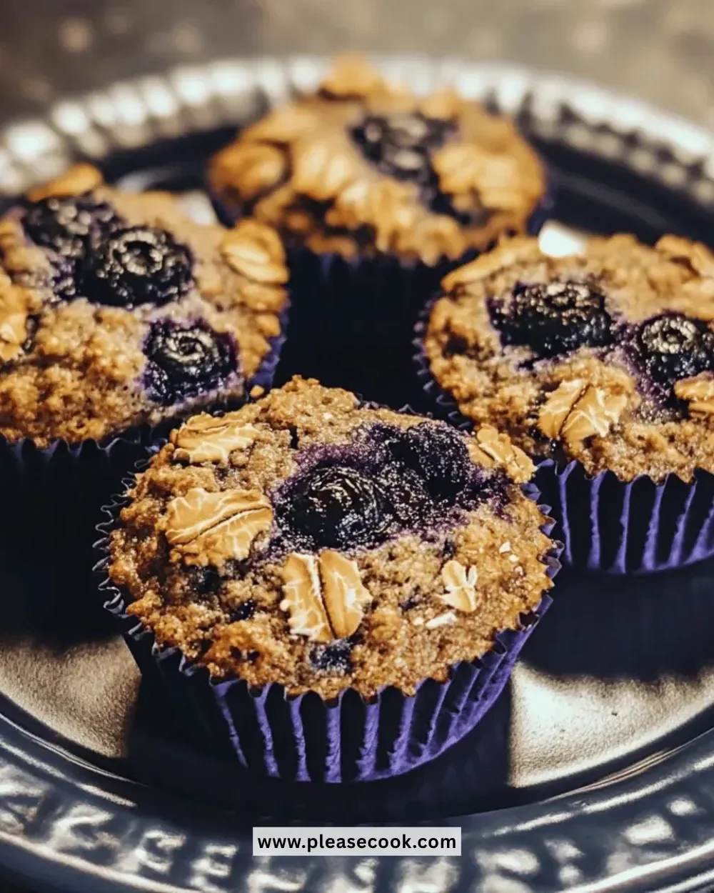 Easy gluten-free blueberry oat muffins served on a plate