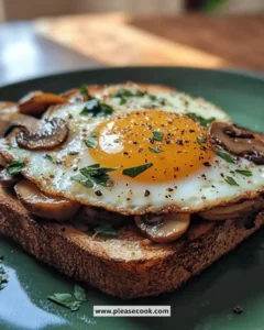 Savory mushroom egg toast topped with fresh herbs on a plate