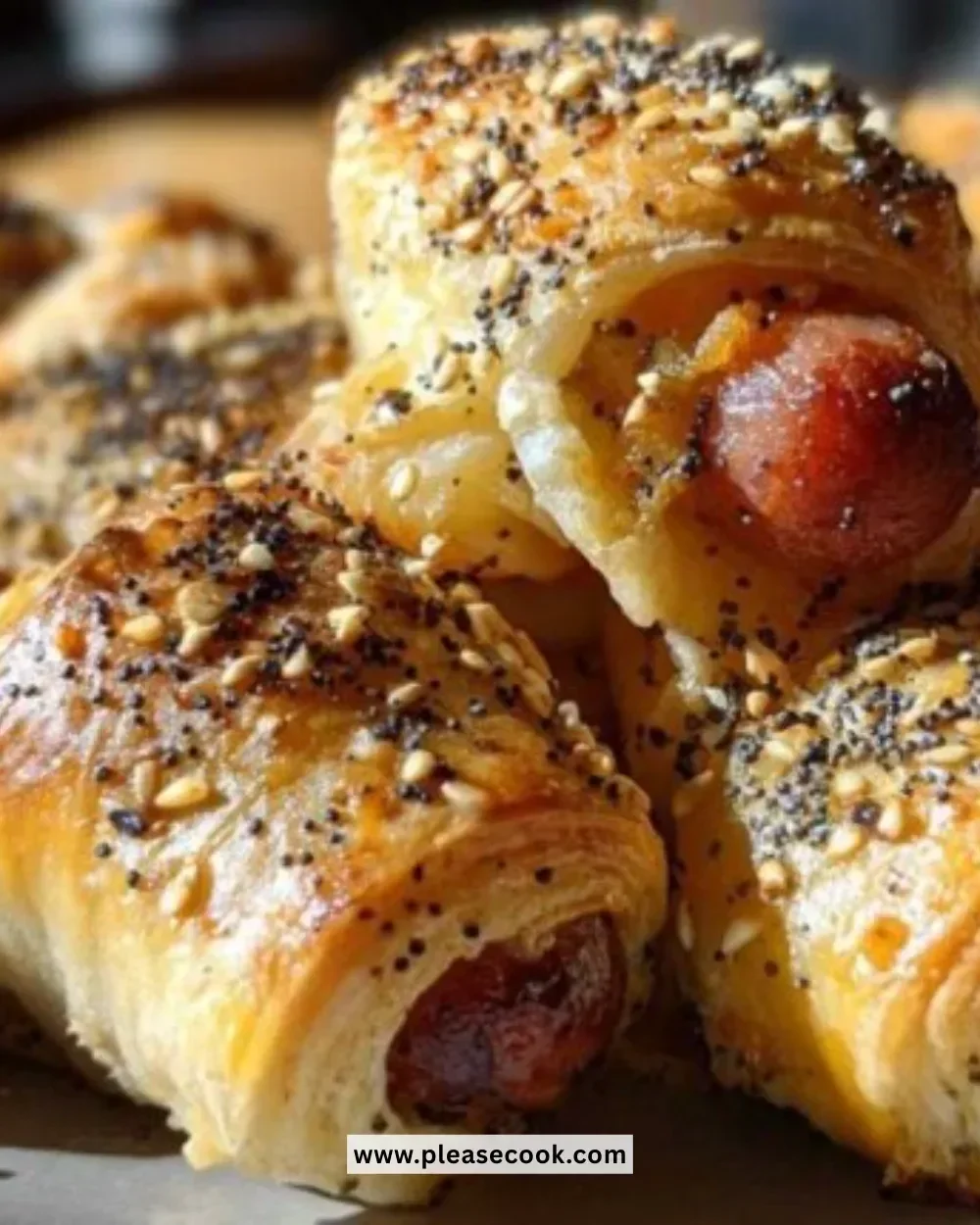 Everything Bagel Pigs in a Blanket appetizer with a sesame seed topping