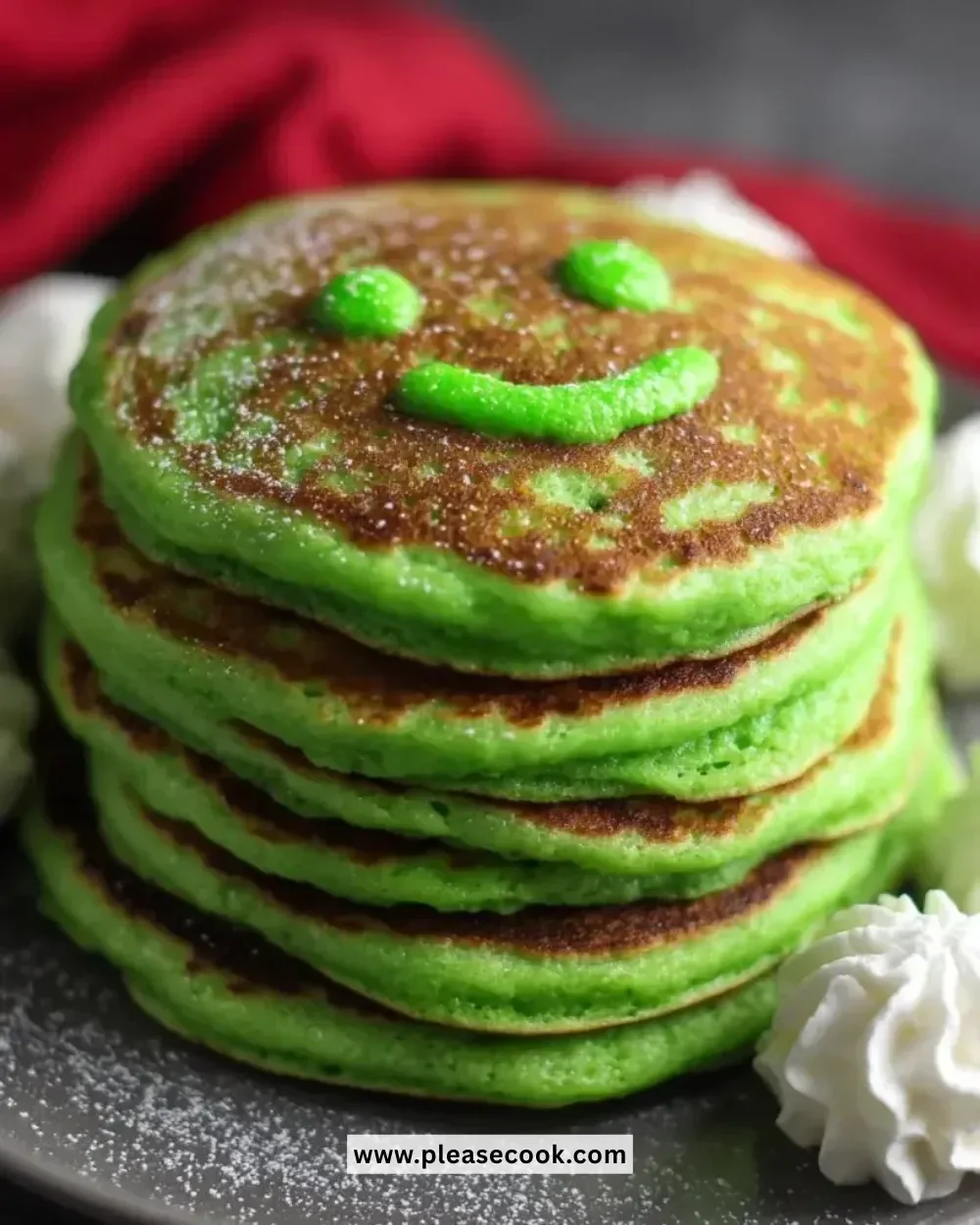 Delicious Grinch Pancakes topped with festive decorations for a holiday breakfast.