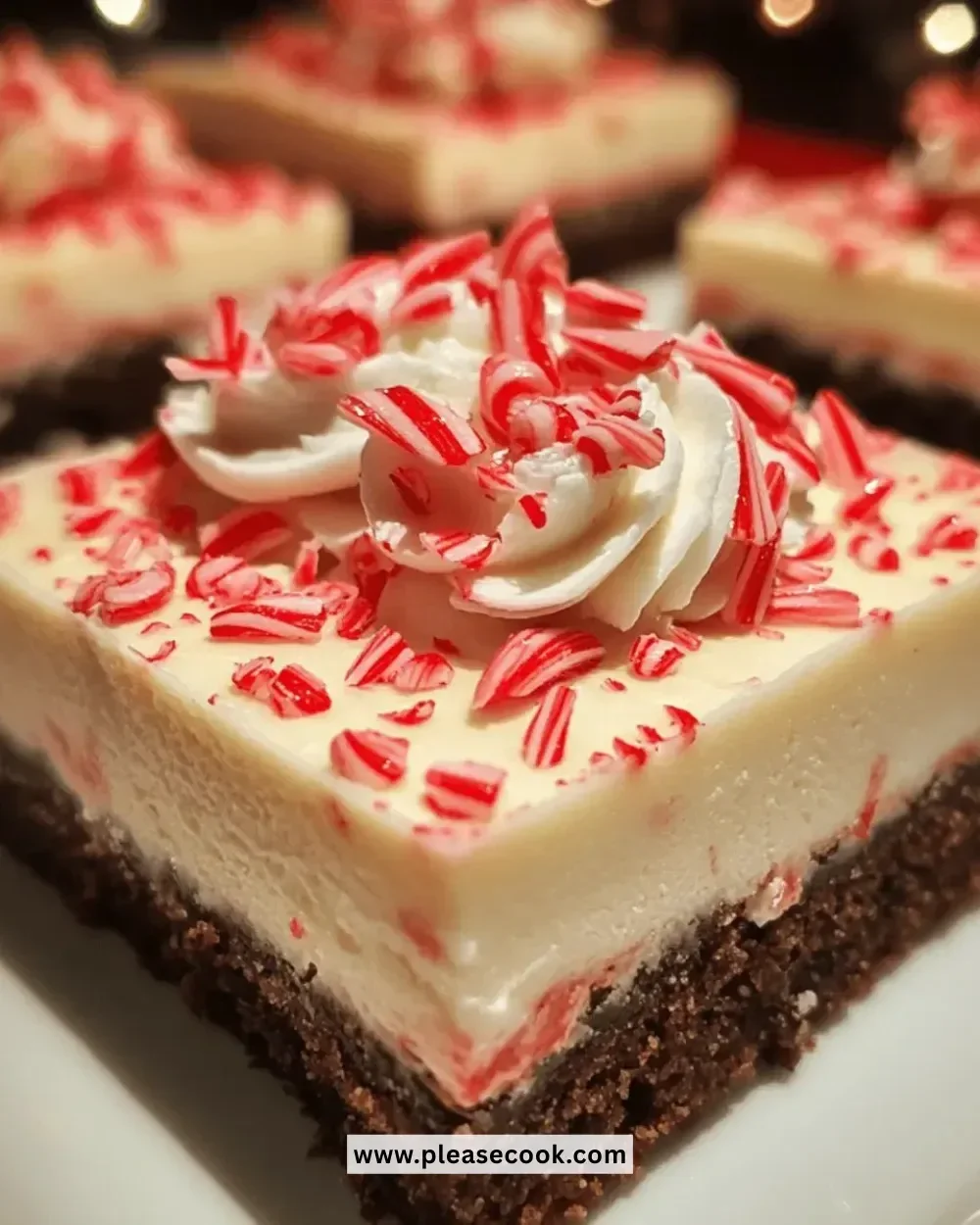 Irresistible Christmas peppermint cheesecake bars topped with festive decorations.