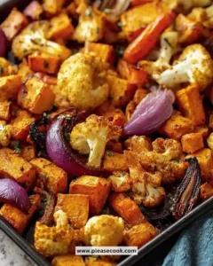 Plate of irresistible harissa roasted vegetables garnished with herbs