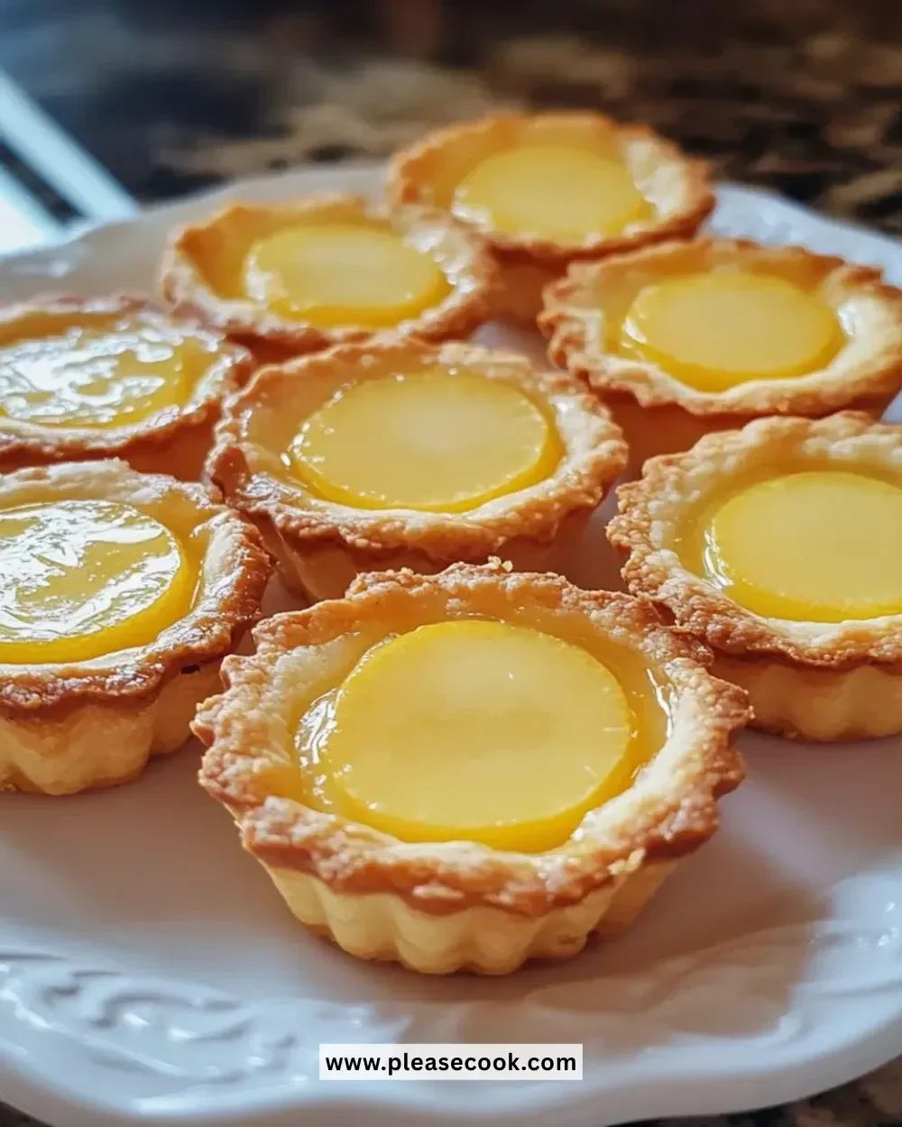 Irresistibly easy mini lemon tartlets topped with fresh lemon zest.