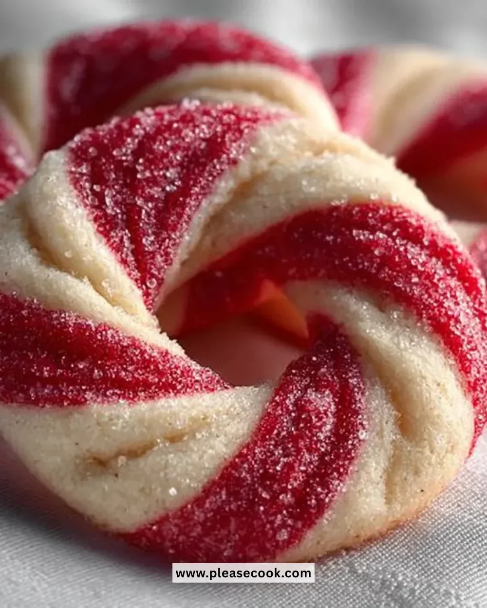 Delicious Candy Cane Cookies decorated with red and white stripes for the holidays.