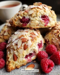Freshly baked raspberry almond scones on a rustic table