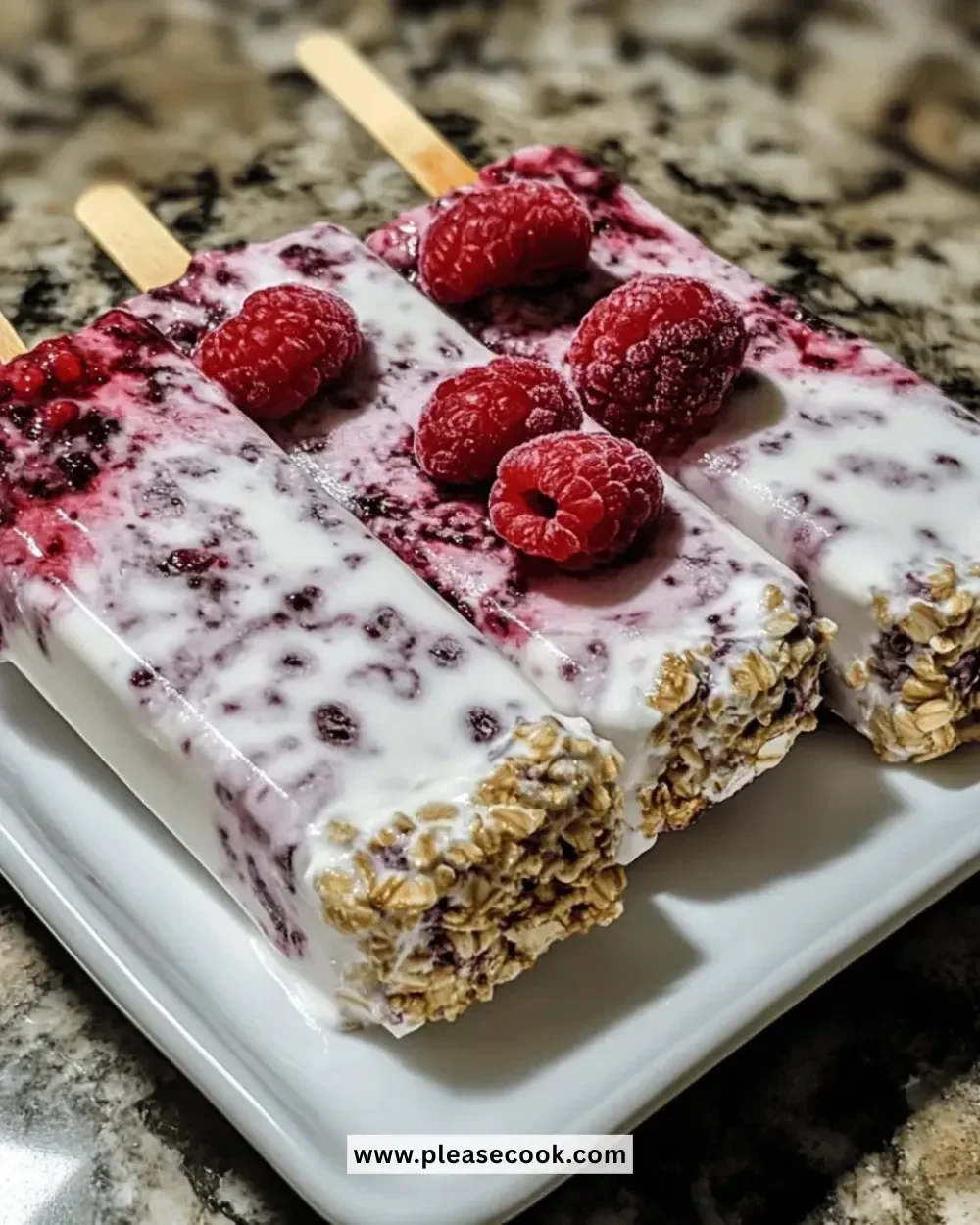 Refreshing mixed berry Greek yogurt pops in a colorful presentation.