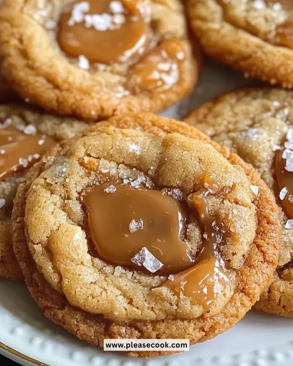 Freshly baked salted caramel cookies on a wooden platter