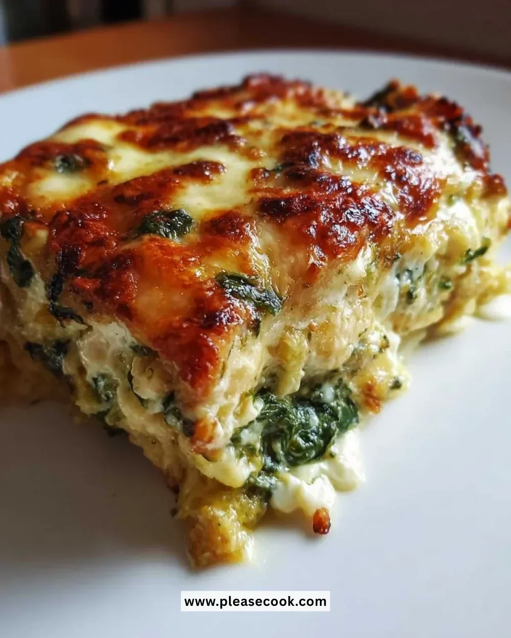 Delicious spinach and squash casserole topped with golden cheese, perfect for healthy meals