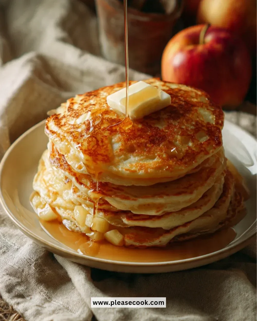 Plate of golden brown almond flour waffles topped with fresh fruit and syrup