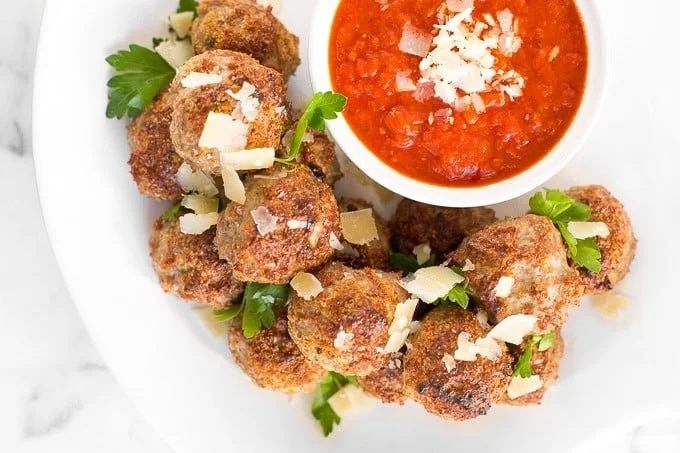 Delicious baked turkey meatballs served with a side of marinara sauce