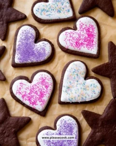 Plate of freshly baked chocolate sugar cookies with chocolate drizzle