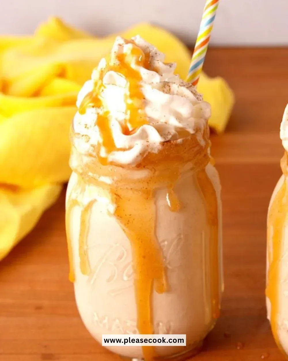 A glass of Bourbon Milk Punch with a sprinkle of nutmeg, showcasing its creamy texture.