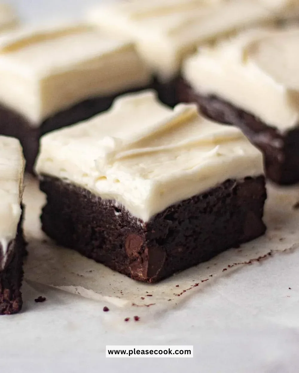 Delicious brownies with smooth cream cheese frosting on top.