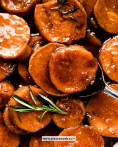 Delicious candied sweet potatoes topped with syrup and spices