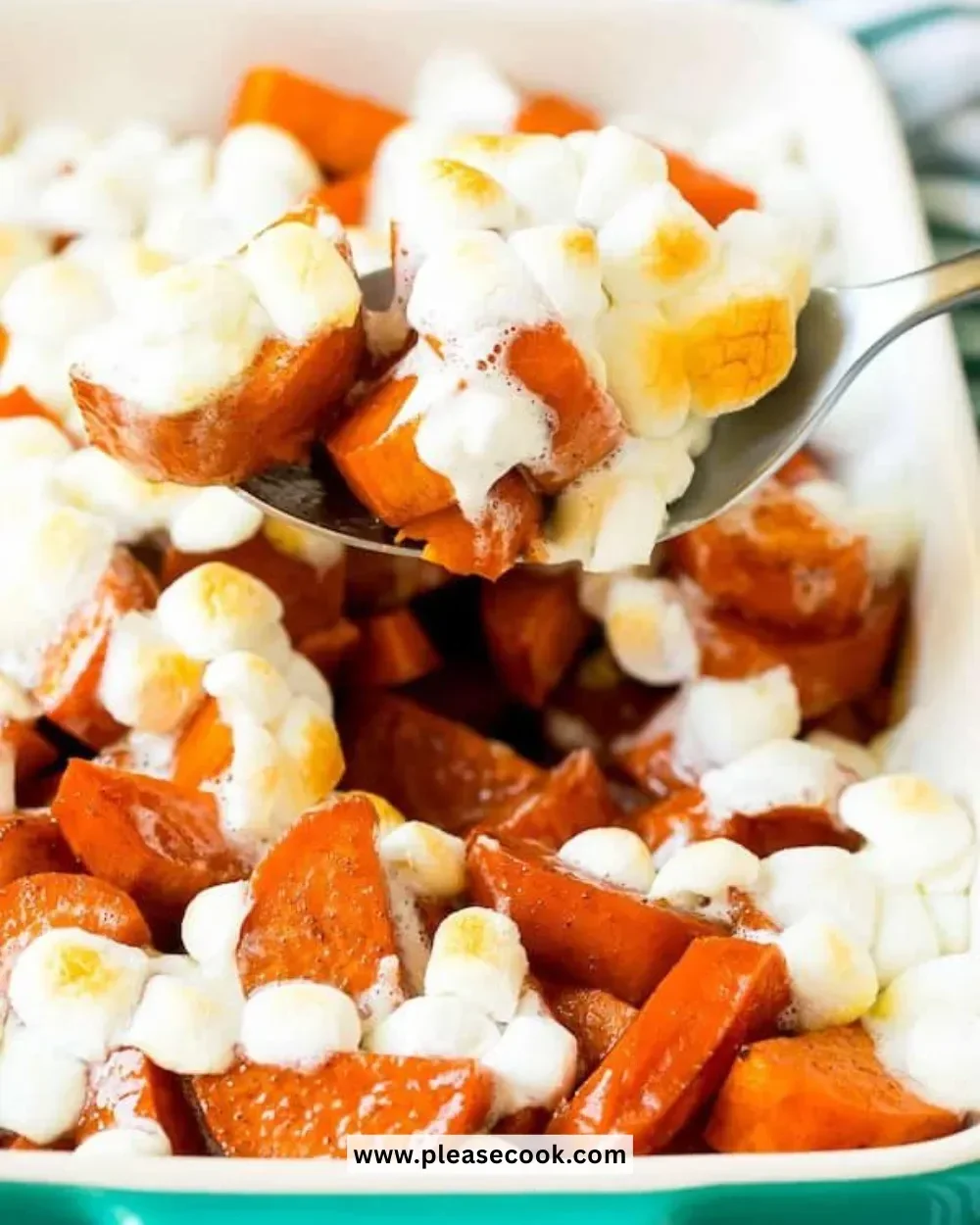 Delicious candied yams topped with marshmallows and pecans.