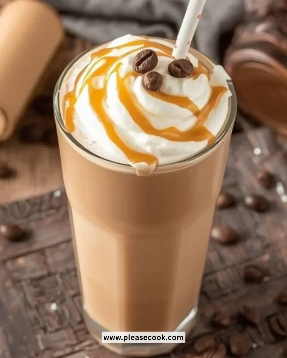 Delicious Caramel Coffee Slushie in a glass topped with whipped cream and caramel drizzle