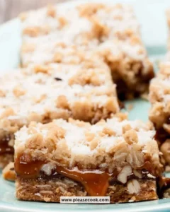 Delicious homemade Carmelita Bars with oats, chocolate, and caramel