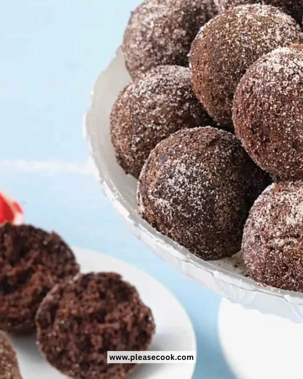 Delicious homemade chocolate cake doughnut holes on a plate garnished with powdered sugar