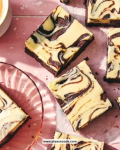 Delicious chocolate cheesecake brownies topped with creamy cheesecake layer.