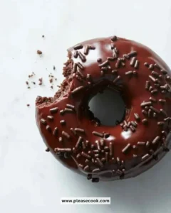 Delicious Chocolate Fudge Cake Doughnuts topped with rich chocolate glaze