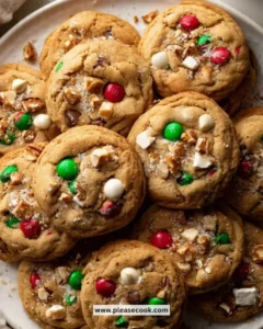 Batch of colorful Christmas Kitchen Sink Cookies on a festive plate.