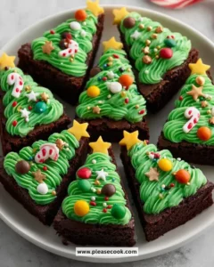 Christmas Tree Brownie Bites decorated with festive icing and sprinkles.