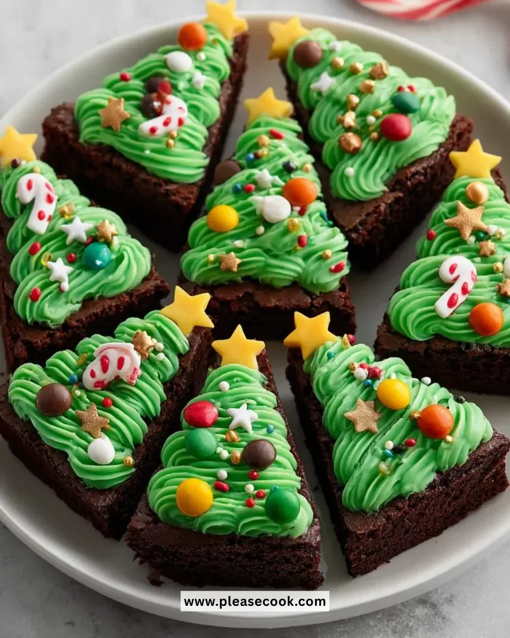 Christmas Tree Brownie Bites decorated with festive icing and sprinkles.