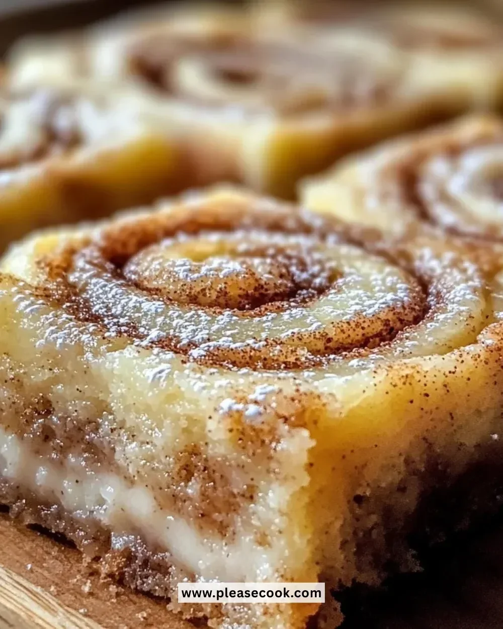 Delicious cinnamon roll bliss bars topped with icing and cinnamon