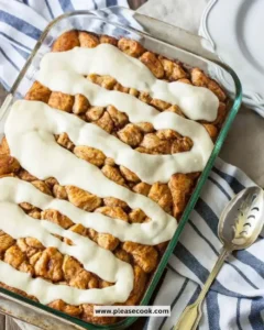Delicious cinnamon roll casserole served warm with icing drizzle