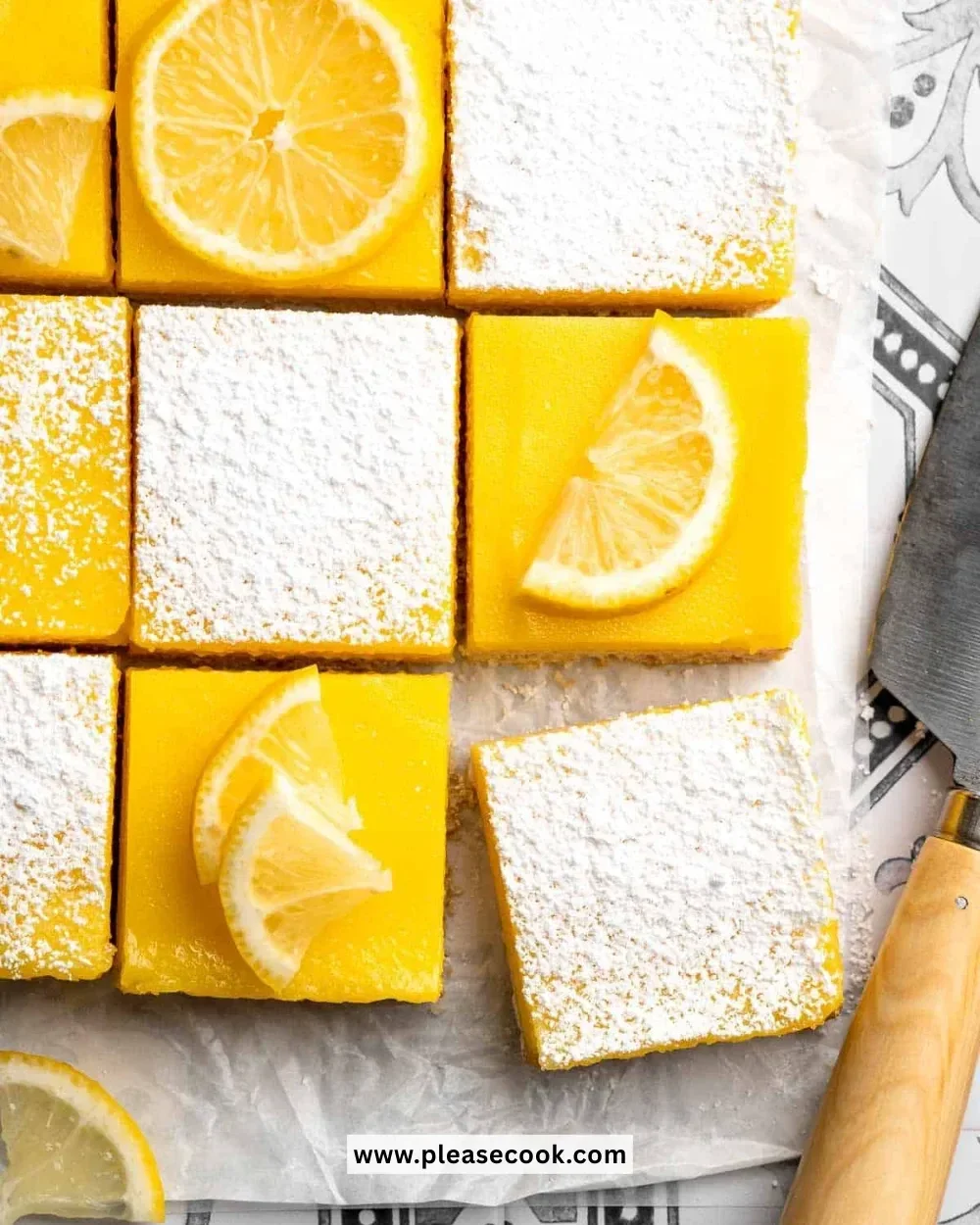 Classic lemon bars with a golden shortbread crust on a white plate