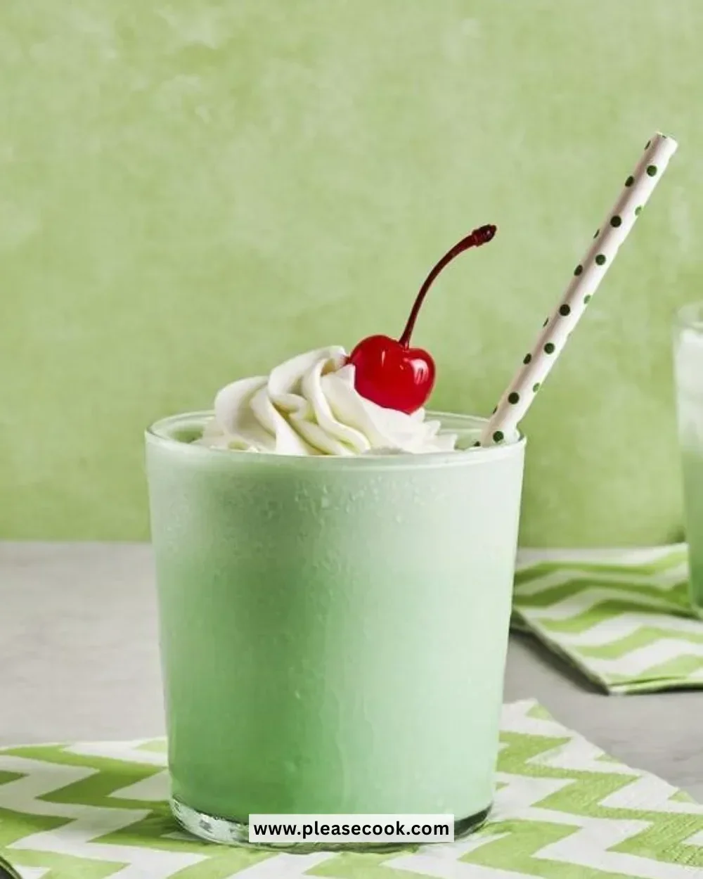 Homemade McDonald's Shamrock Shake copycat recipe in a glass with whipped cream