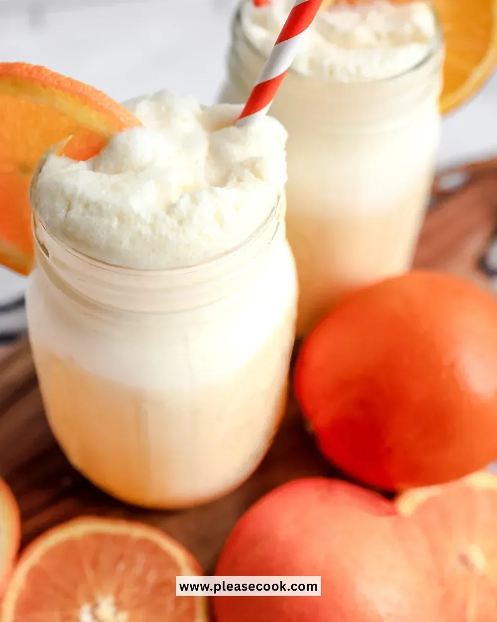 Creamy Creamsicle Milkshake Slushi in a vibrant cup with a straw