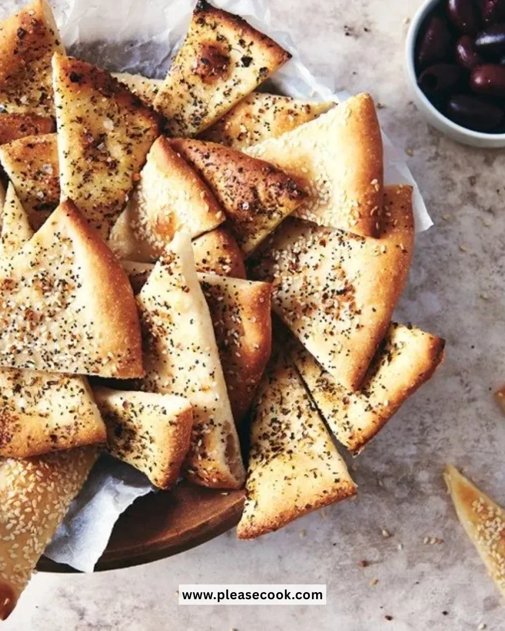 A plate of crispy cracker bread served with various dips and toppings.