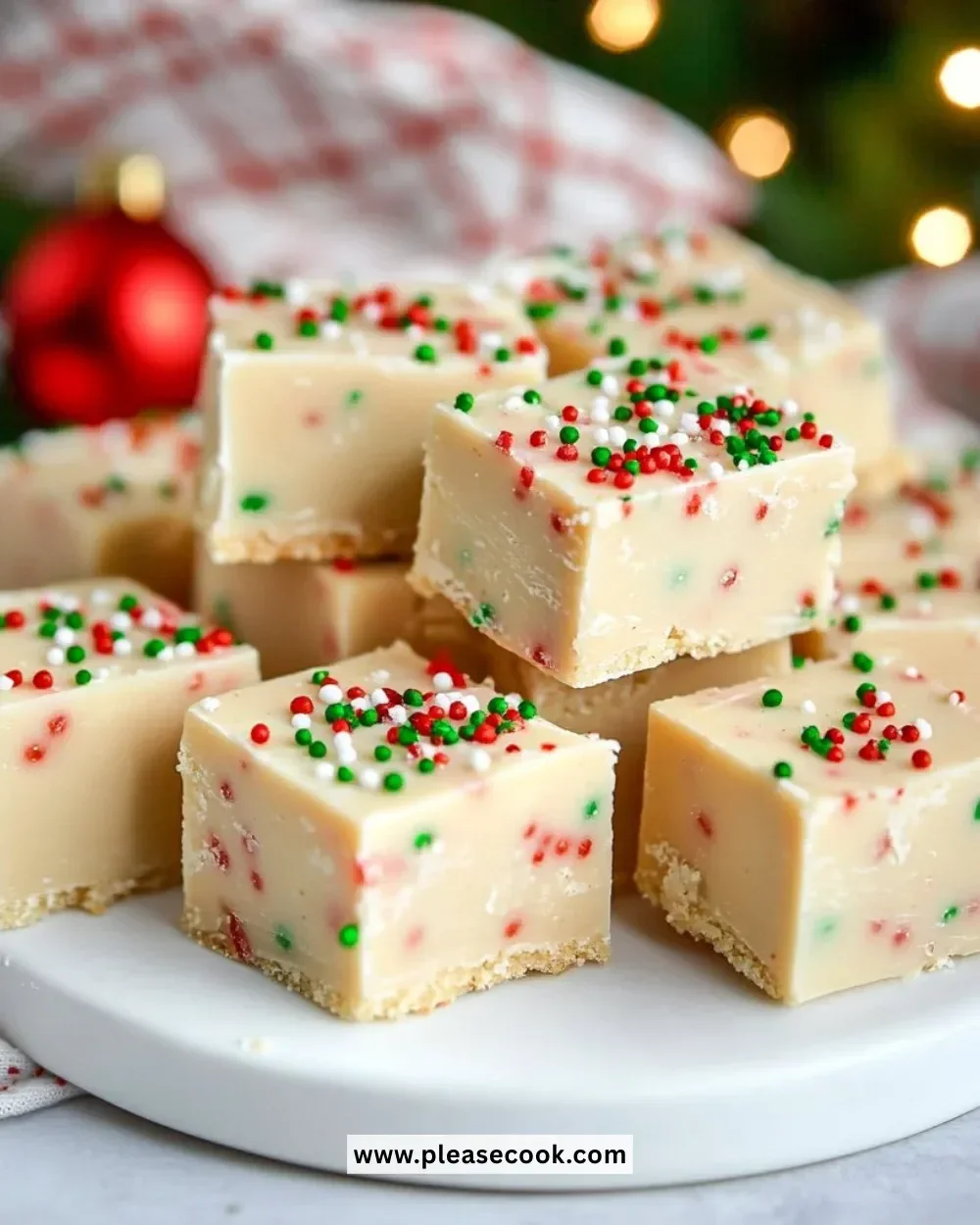 Festive sugar cookie fudge on a plate, perfect for holiday celebrations.