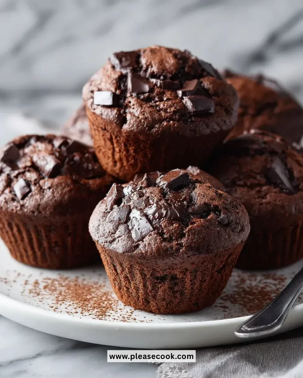 Freshly baked espresso double chocolate muffins on a cooling rack