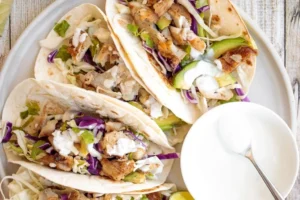 Delicious fish tacos served with lime crema for a zesty flavor