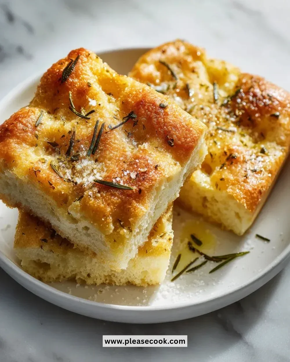 Fluffy mini focaccia bread fresh out of the oven, golden brown and delicious.