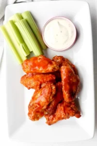 Delicious Buffalo Hot Wings on a plate, perfect for game day.