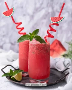 Refreshing homemade watermelon slushie served in a glass with ice.