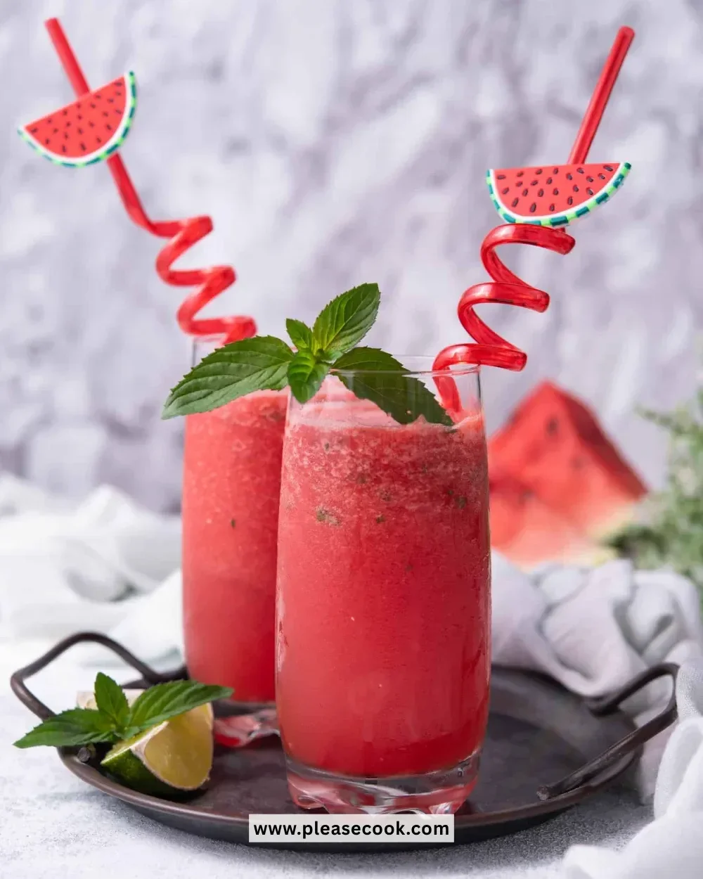 Refreshing homemade watermelon slushie served in a glass with ice.
