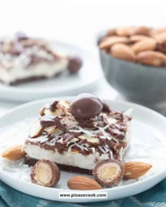 Keto Almond Joy Cheesecake Bars with chocolate and almond toppings