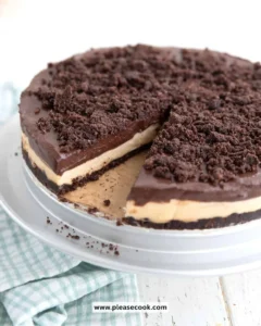 Slice of Keto Peanut Butter Dirt Cake topped with chocolate and nuts.